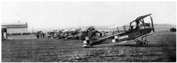 Aircraft of the Greater Poland Air Force at the airport in Ławica during the celebrations of the 128th anniversary of the adoption of the 3rd of  May Constitution. At the forefront, there is a reconnaissance aircraft – Rumpler C.Ib (Ma) No. 13029 (Ławica Air Base No. 107/17), behind it, there is the reconnaissance aircraft - LVG C.V No. 1099/18, then, there are three other LVG C.Vs, the last one in the row is an Albatros C.XV aircraft. In the background, another two-seater aeroplane is visible between the Rumpler and the first LVG.
Photo from the collection of Priest R. Kulczyński SDB